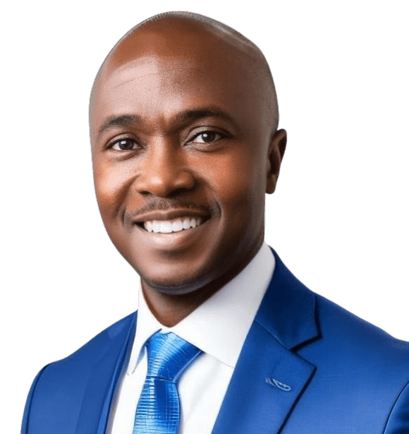 Sam Smith, a smiling man wearing a blue suit, white shirt, and blue tie, posed against a plain light background.
